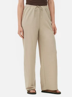 Calças Cordão Corte Perna Direita